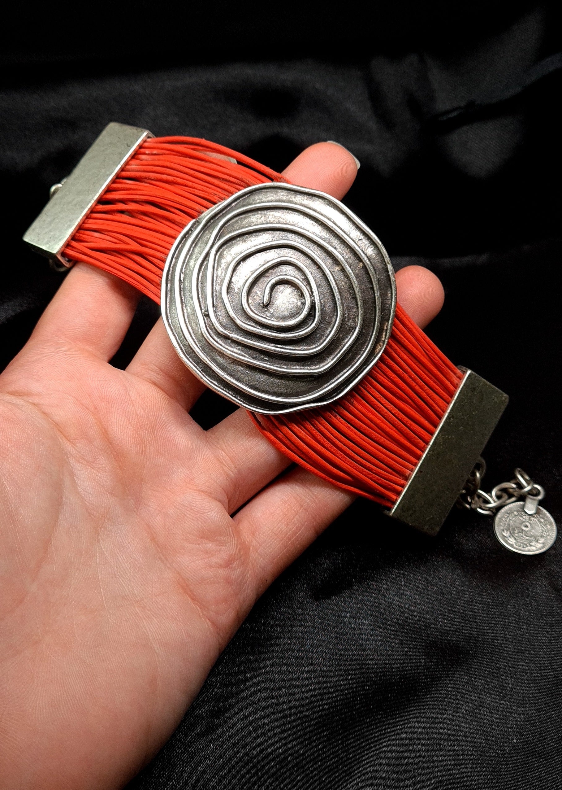 Brigitta Bracelet a silver bracelet with red leather straps