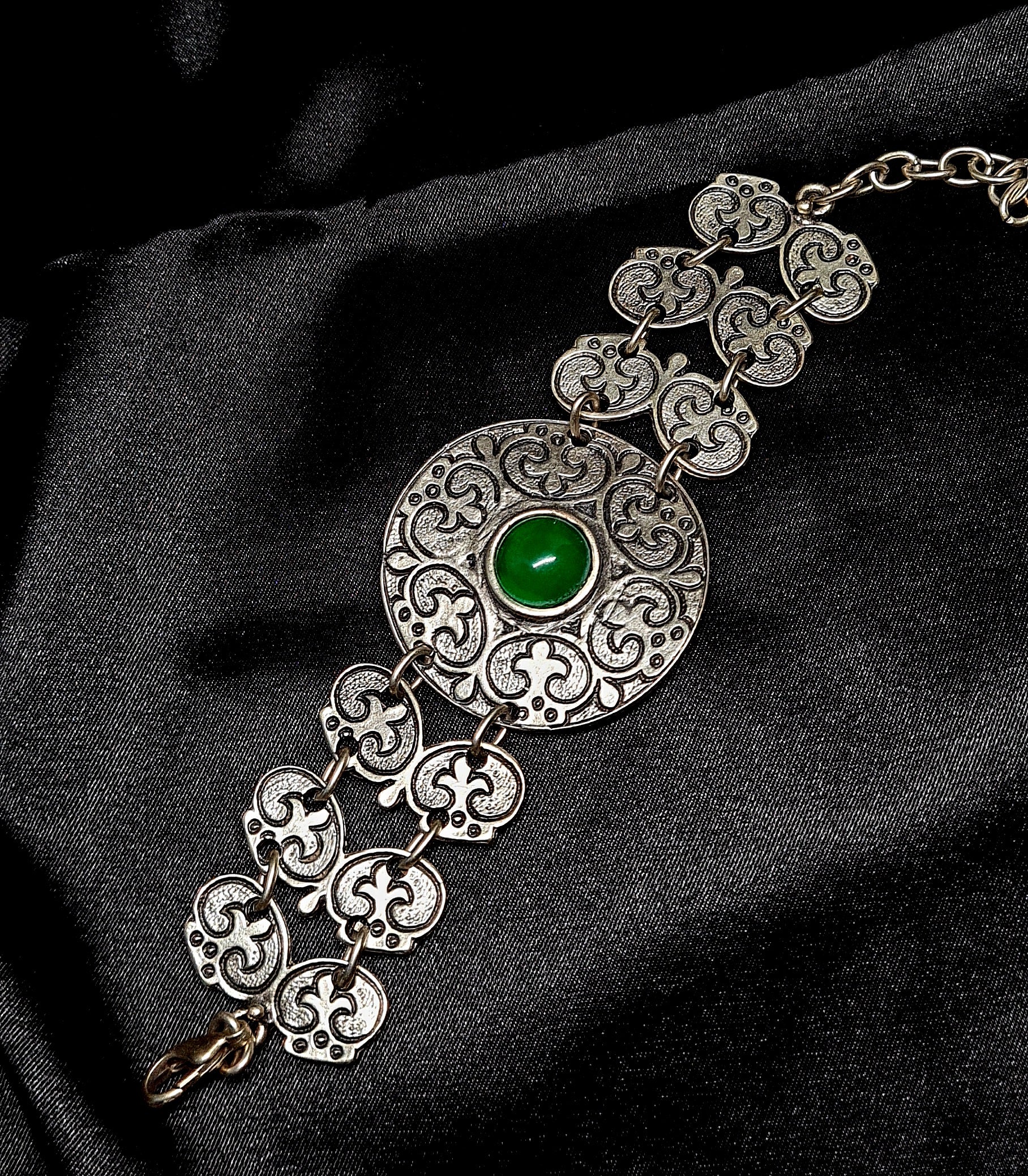 Fay Bracelet a delicate metalwork with a vibrant green stone