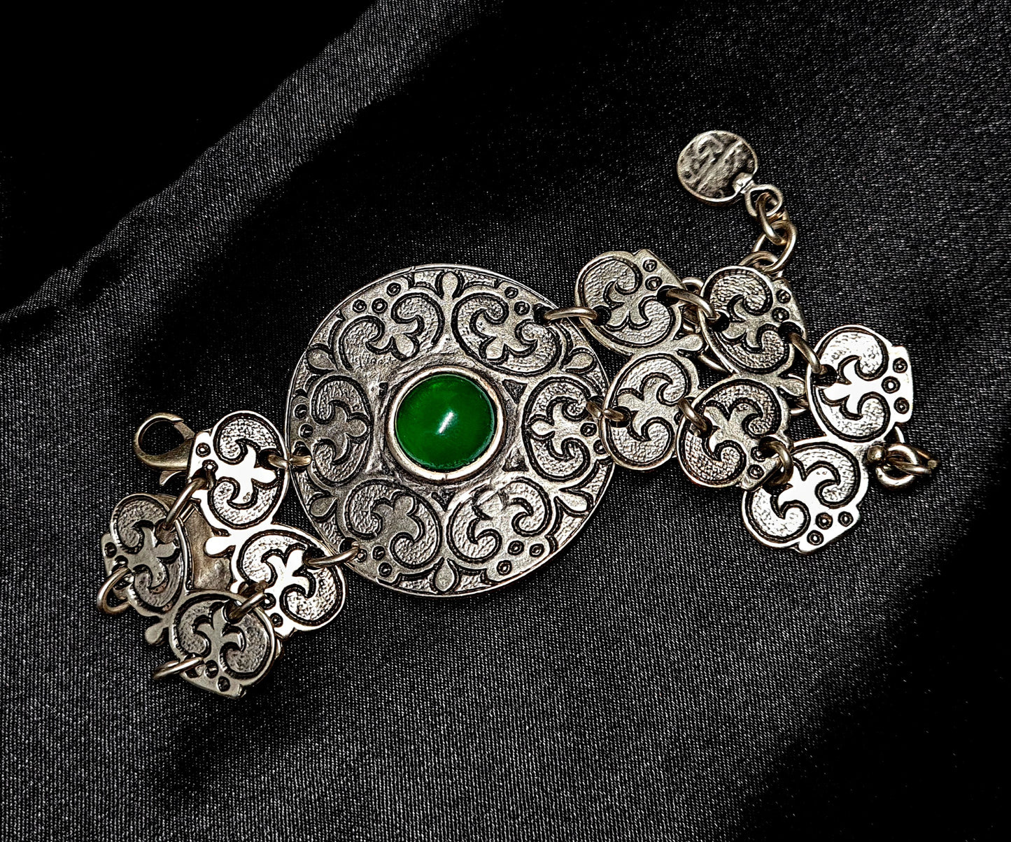 Fay Bracelet a delicate metalwork with a vibrant green stone