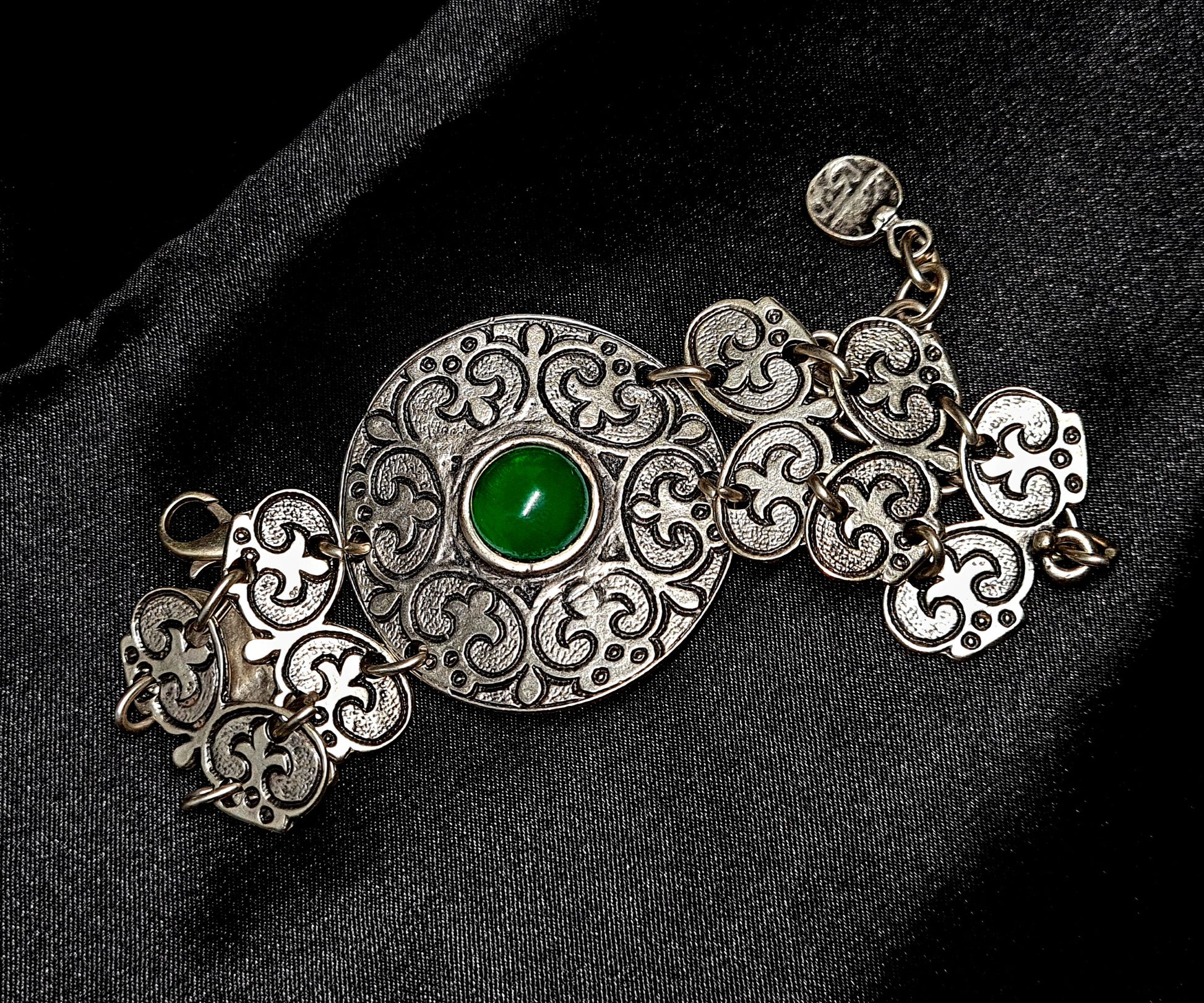 Fay Bracelet a delicate metalwork with a vibrant green stone