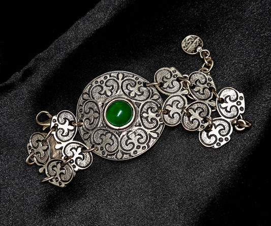 Fay Bracelet a delicate metalwork with a vibrant green stone