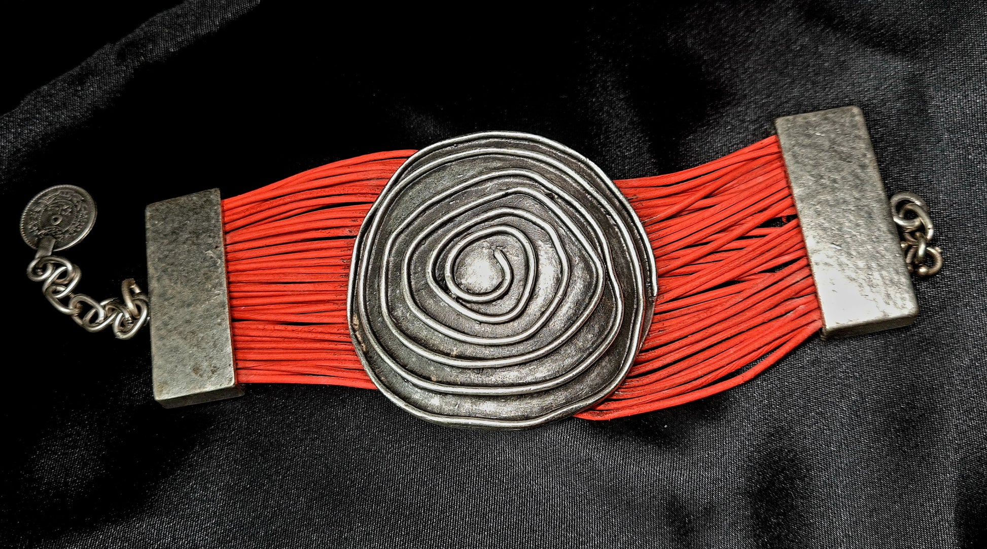 Brigitta Bracelet a silver bracelet with red leather straps