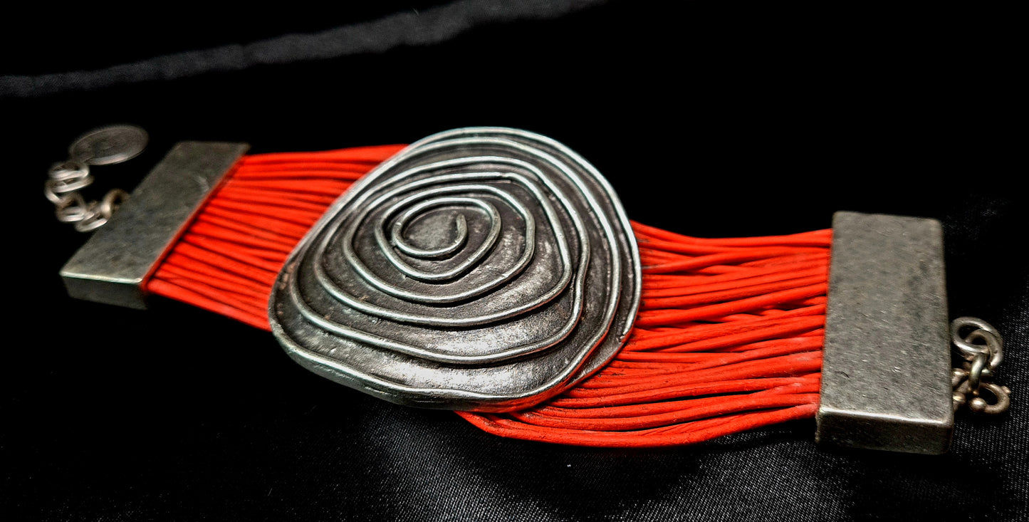 Brigitta Bracelet a silver bracelet with red leather straps