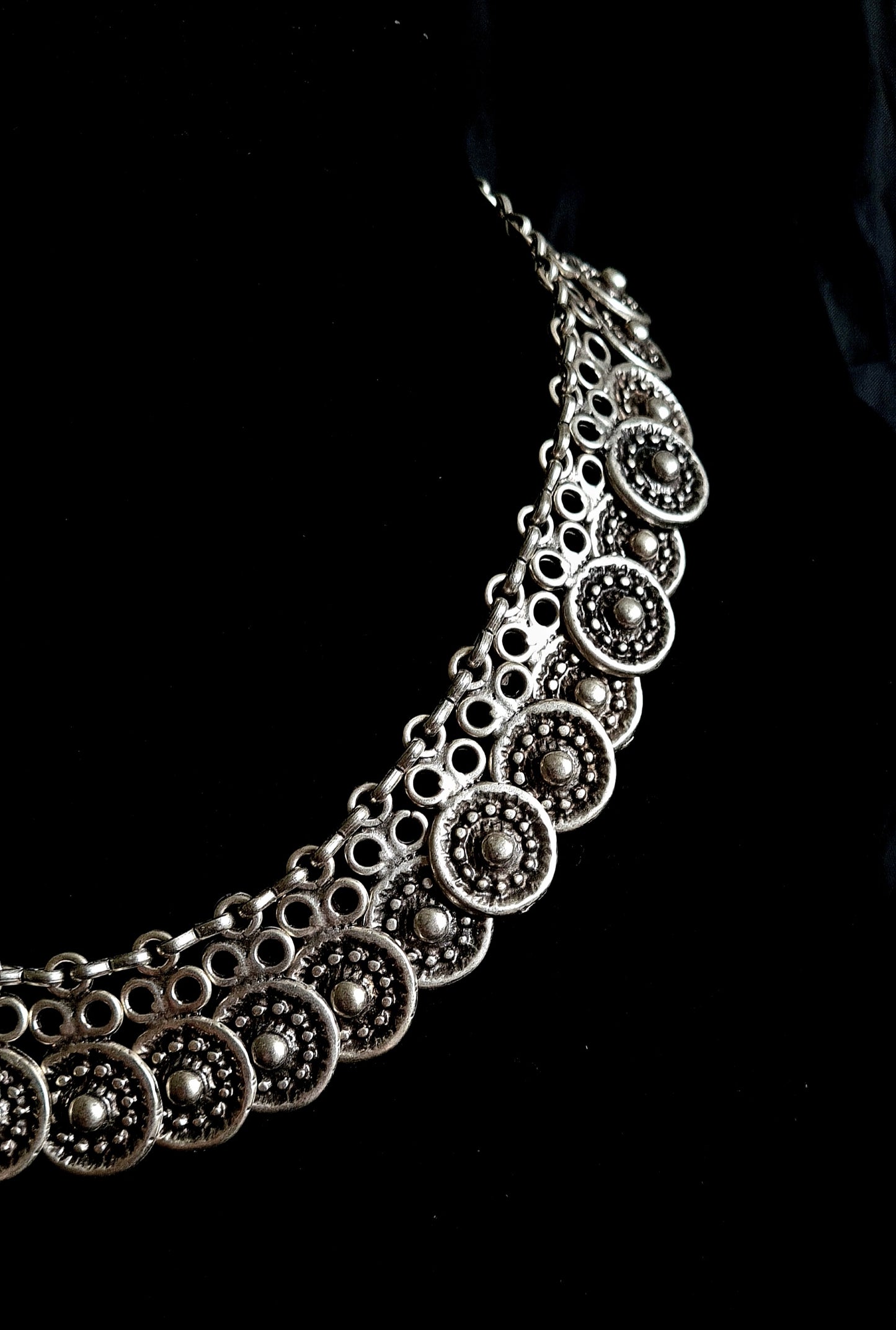 Enya Necklace showcasing its intricate filigree design and sparkling accents.