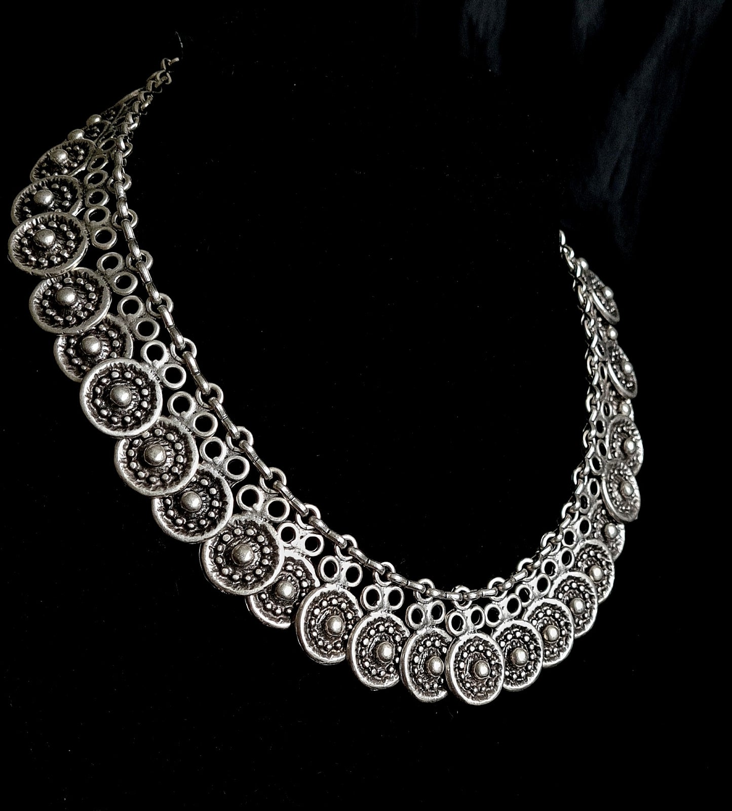 Enya Necklace showcasing its intricate filigree design and sparkling accents.