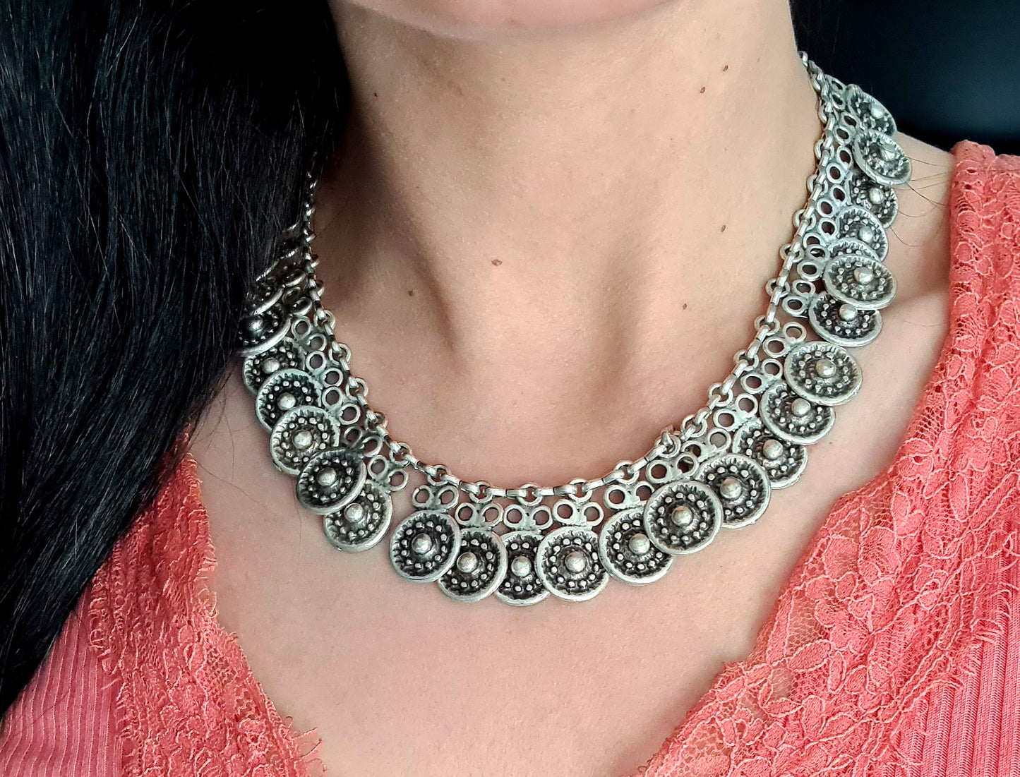 Enya Necklace showcasing its intricate filigree design and sparkling accents.