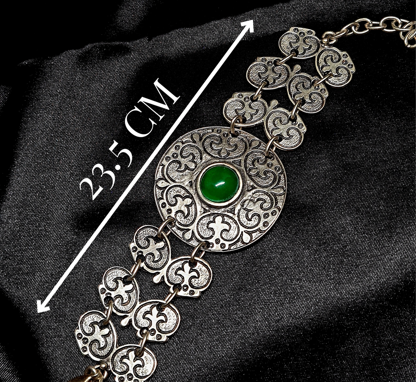 Fay Bracelet a delicate metalwork with a vibrant green stone
