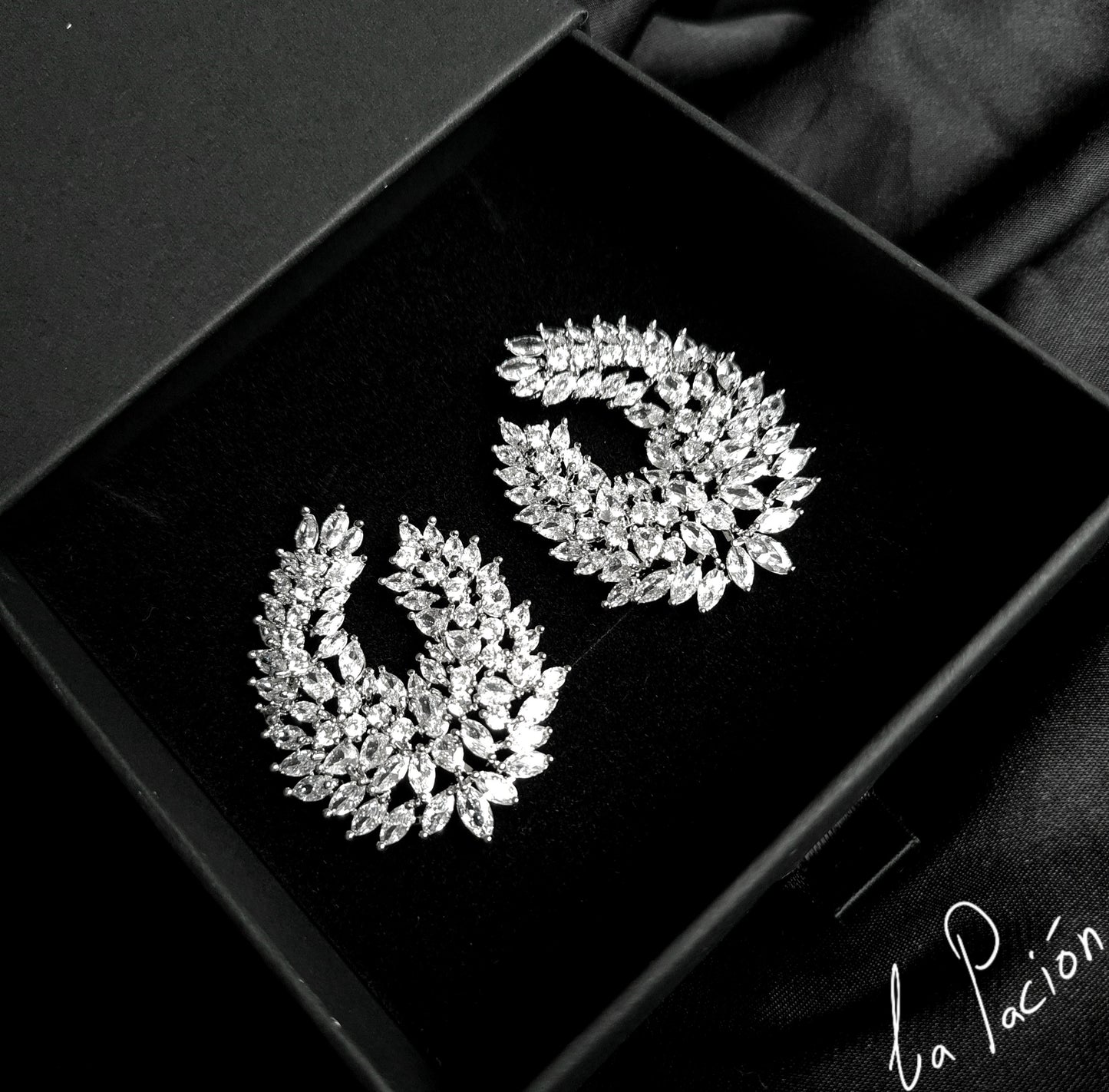 Clair Stud Earrings featuring cubic zirconia stones arranged in a captivating waterdrop shape