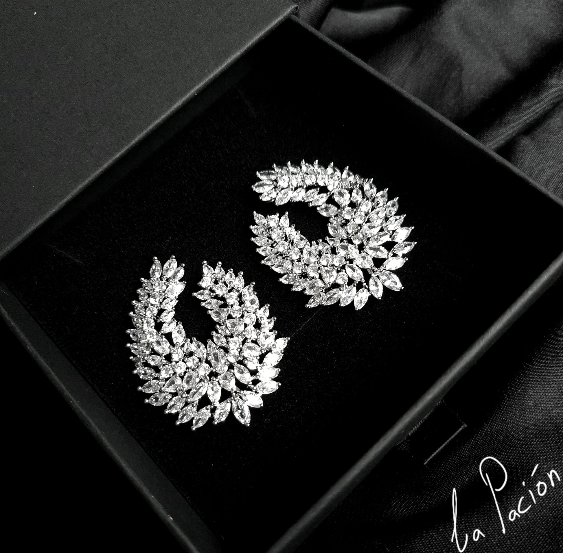 Clair Stud Earrings featuring cubic zirconia stones arranged in a captivating waterdrop shape
