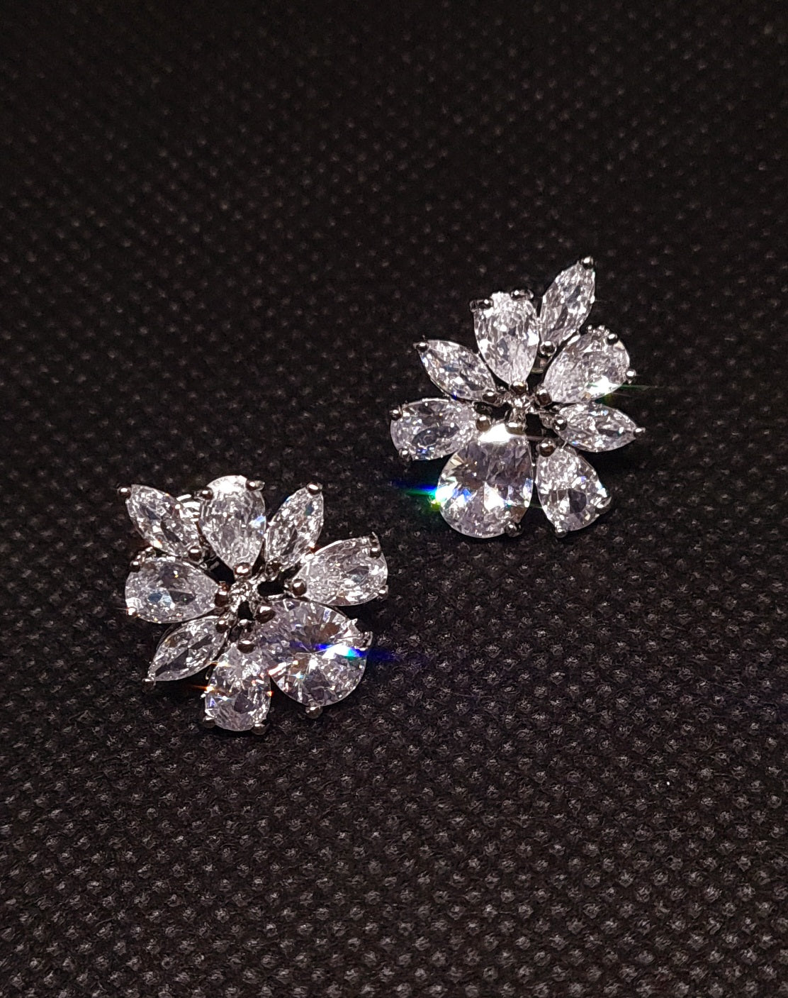 Bloem Earring a floral design with silver petals adorned with cubic zirconia stones.