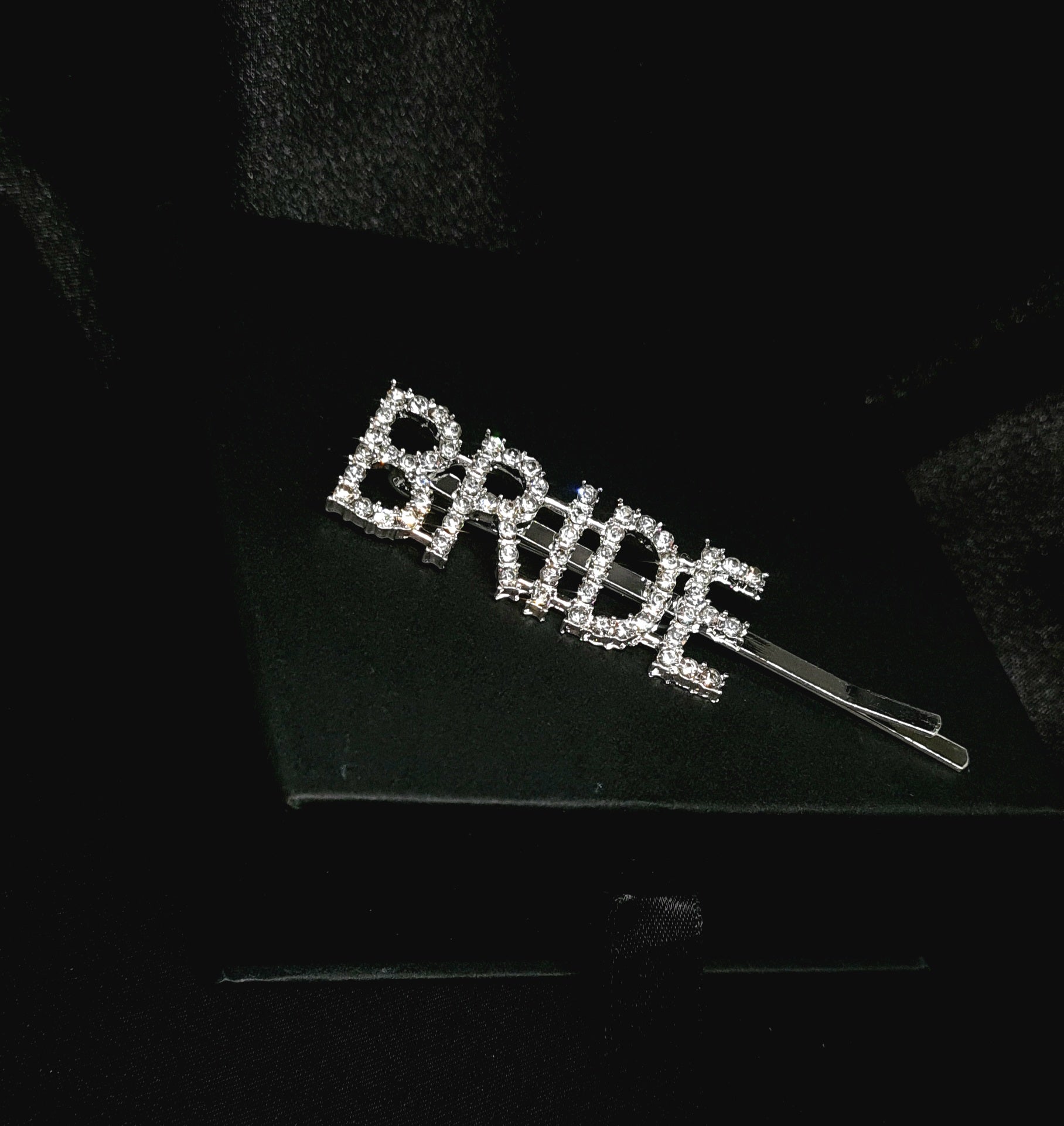 Bride Pin an elegant accessory crafted in silver with radiant crystal accents and cubic zirconia stones.