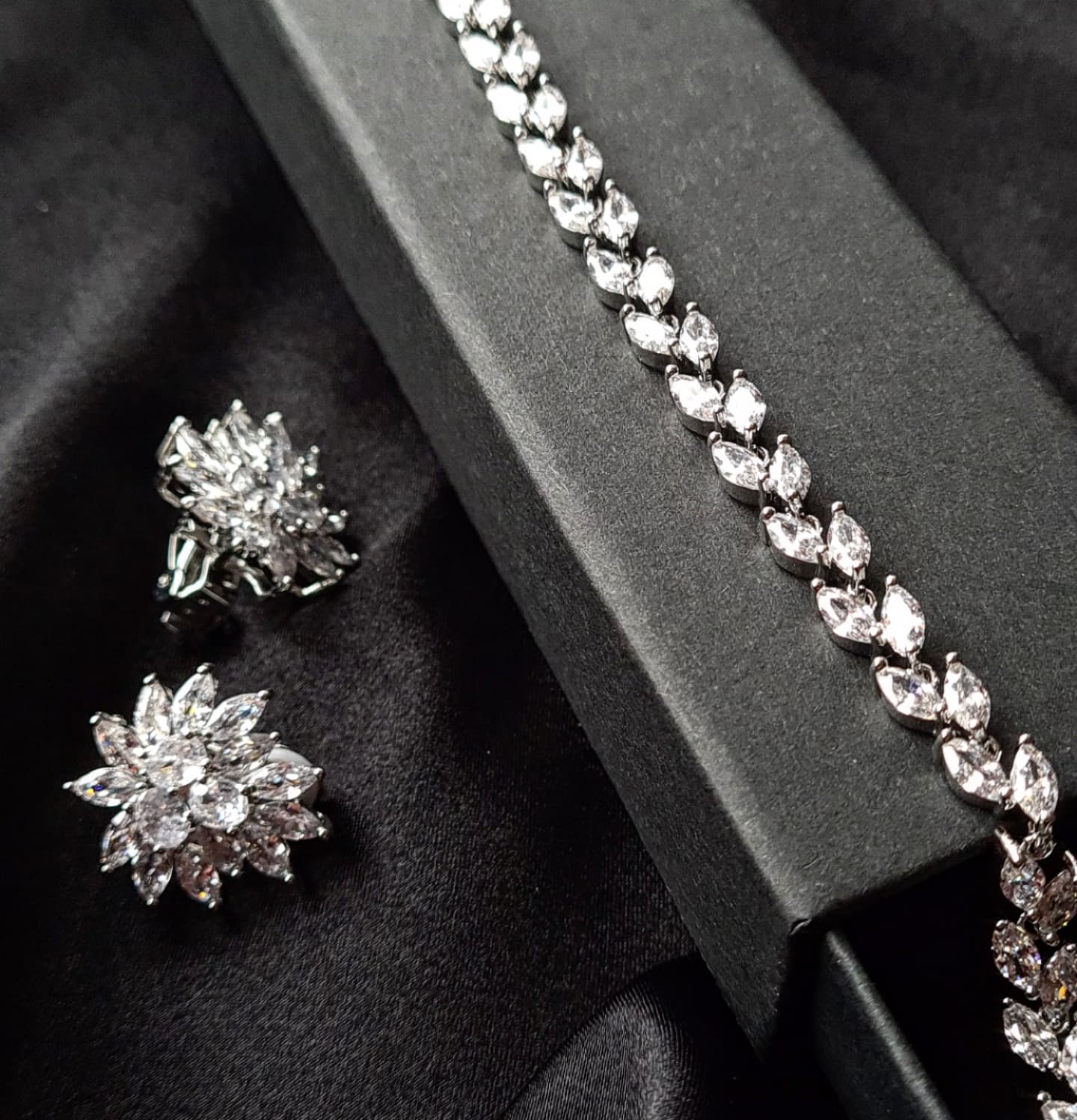 Cathy Earrings featuring exquisite cubic zirconia stones set in gleaming silver.