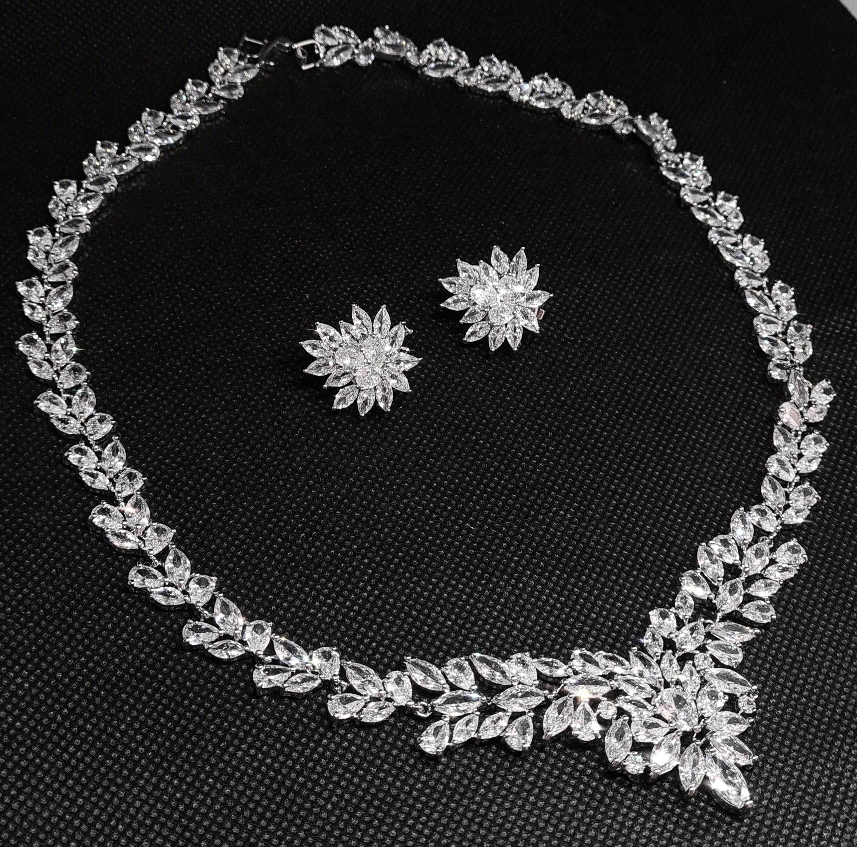 Anne Marie necklace with intricate floral design and sparkling cubic zirconia stones.
