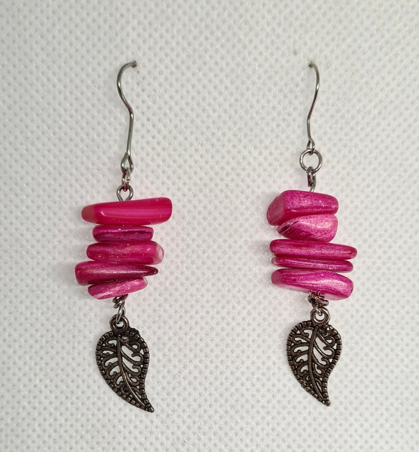 Chloe Earrings featuring exquisite handmade dangle drops adorned with a leaf charm in a vibrant color