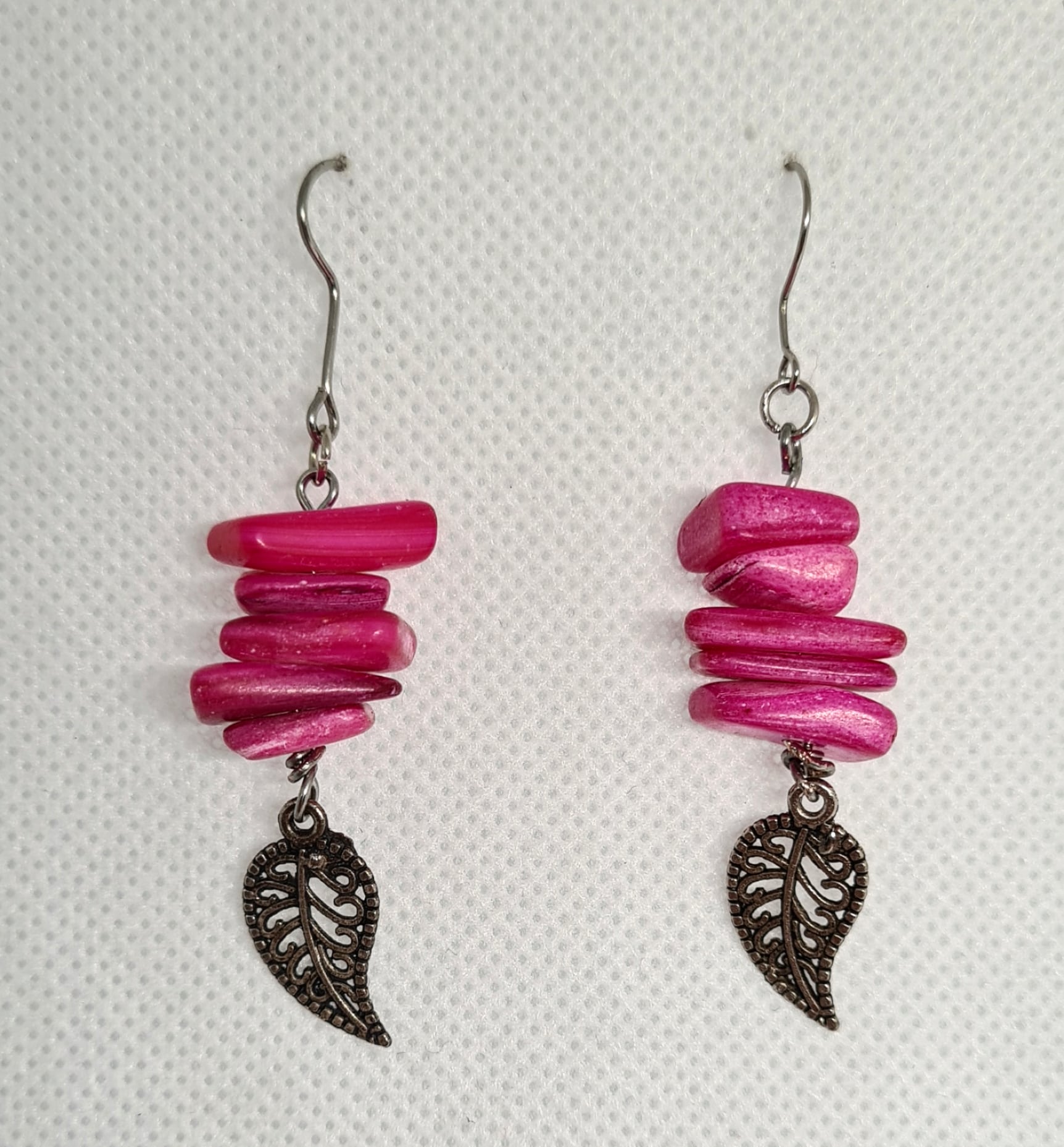 Chloe Earrings featuring exquisite handmade dangle drops adorned with a leaf charm in a vibrant color