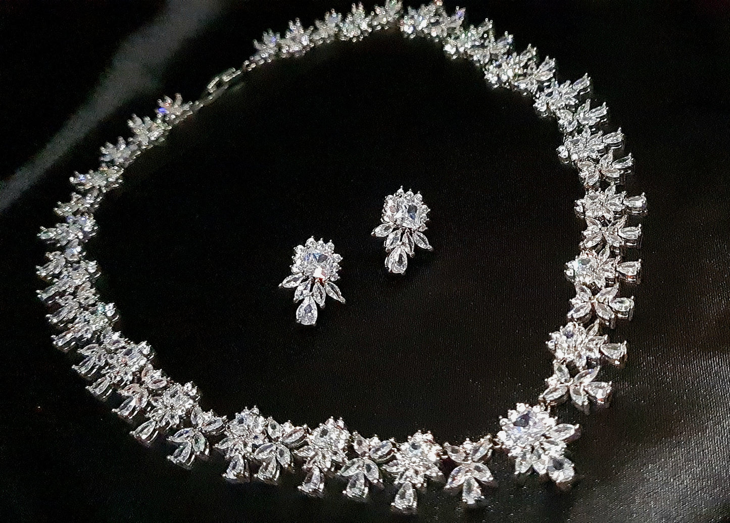 Elegant Adele necklace and earrings, cubic zirconia flower pendant, timeless jewelry.