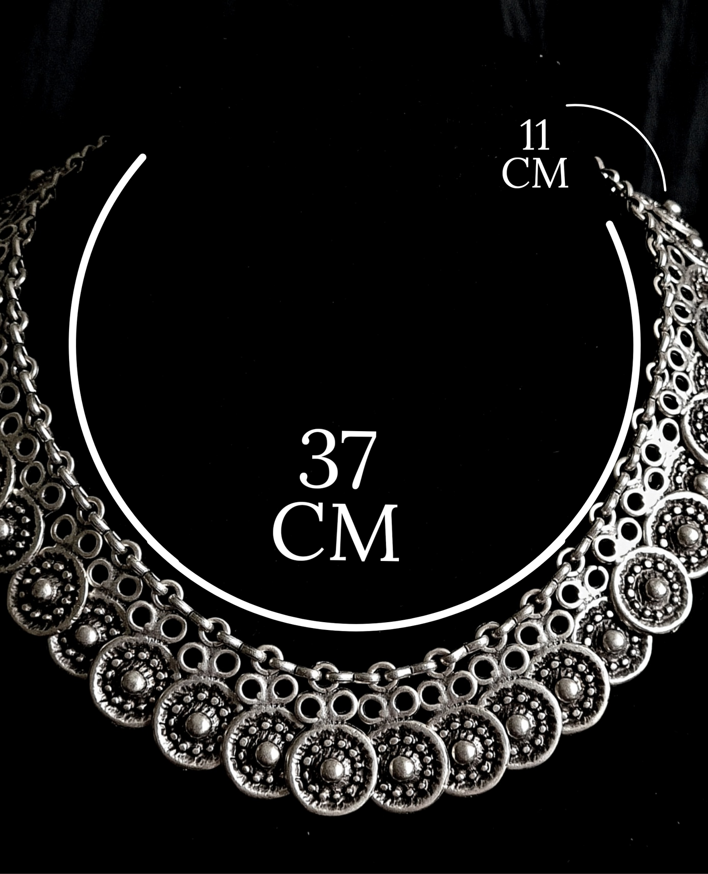 Enya Necklace showcasing its intricate filigree design and sparkling accents.