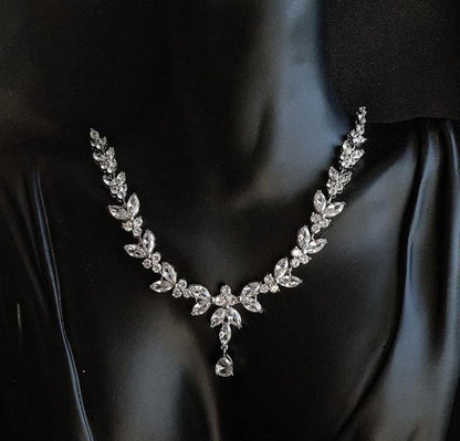 Black Mannequin Jewelry Bust Displaying a silver necklace sparkling with Cubic Zirconia diamonds in a variety of shapes and sizes.