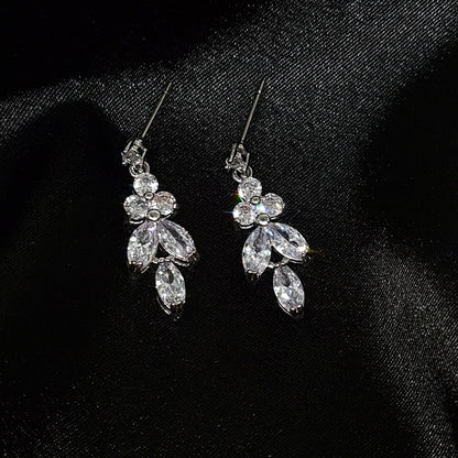 Cubic zirconia earrings elegantly showcased inside a black fabric..