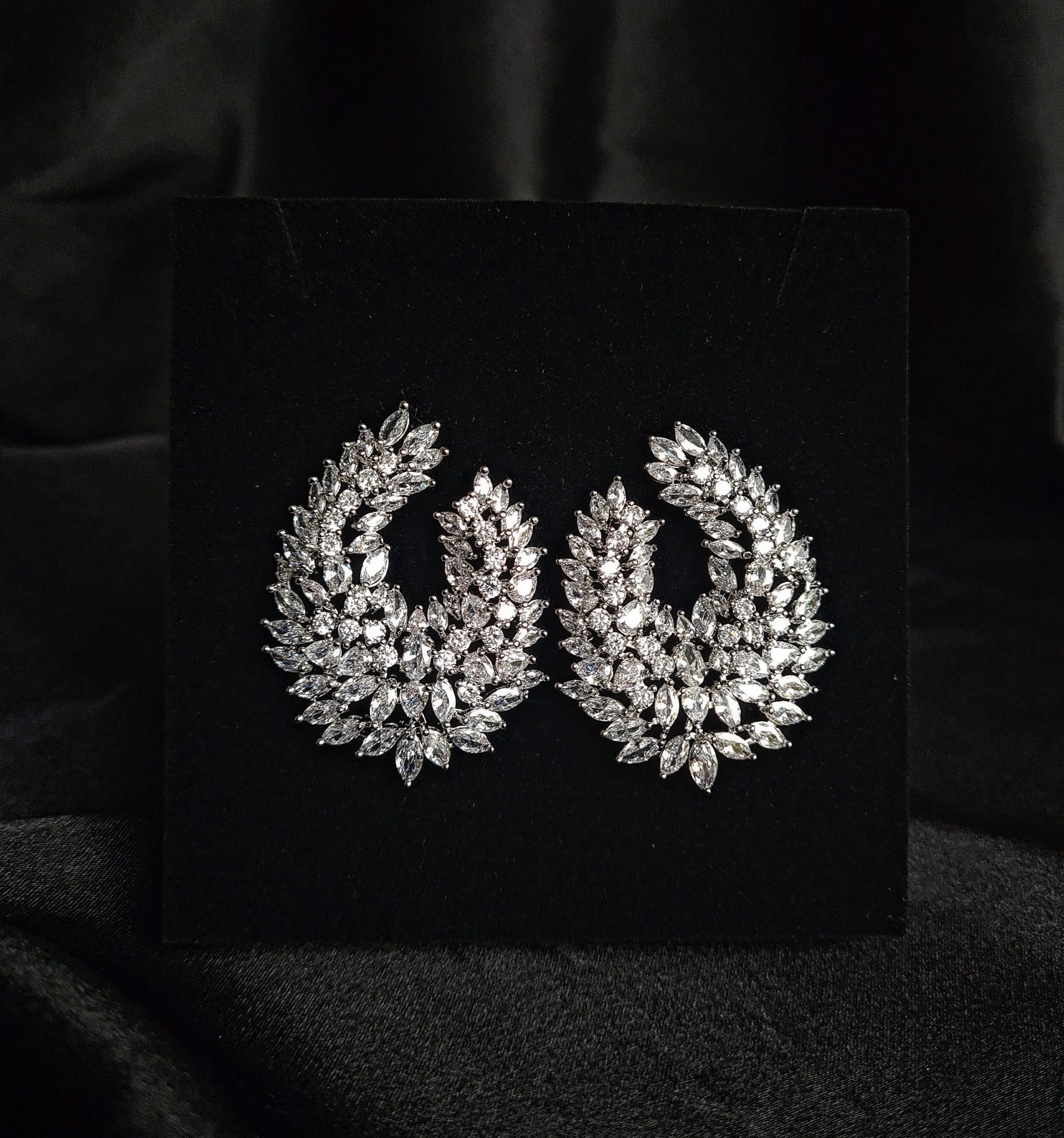 Clair Stud Earrings featuring cubic zirconia stones arranged in a captivating waterdrop shape