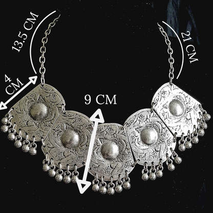 Technical specification view of a silver bohemian medallion necklace on a black background, with minimalist white lines indicating the 180mm bib width and total adjustable chain length.