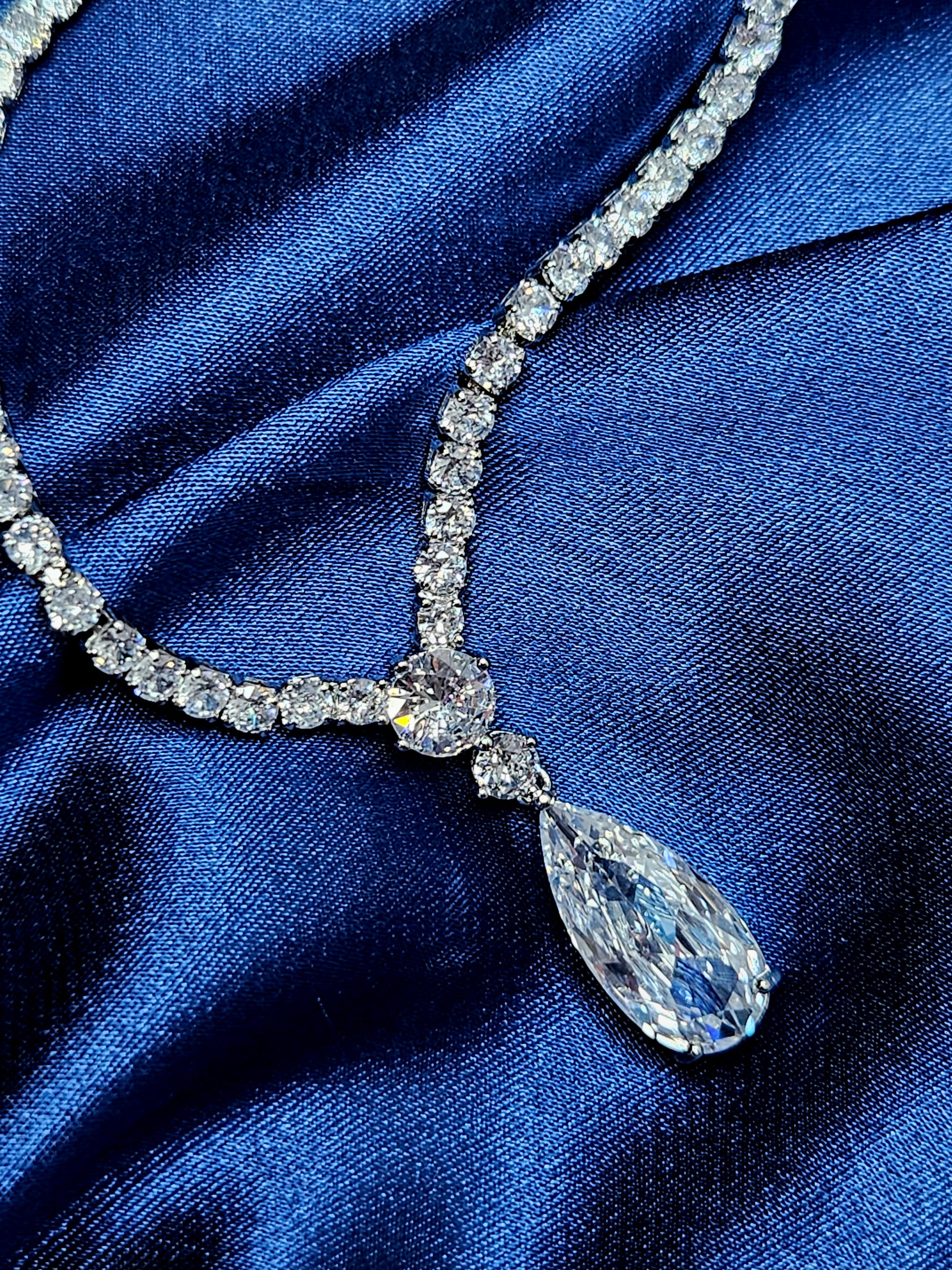 Macro editorial shot of the Tear Necklace pendant, showcasing the intricate pavé setting and the diamond-like brilliance of the central cubic zirconia stone. Professional luxury jewelry detail highlighting high-quality craftsmanship and light-reflecting clarity