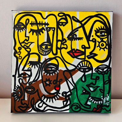 Vibrant abstract painting featuring multiple stylized faces with bold colors and black linework, set against a yellow background.