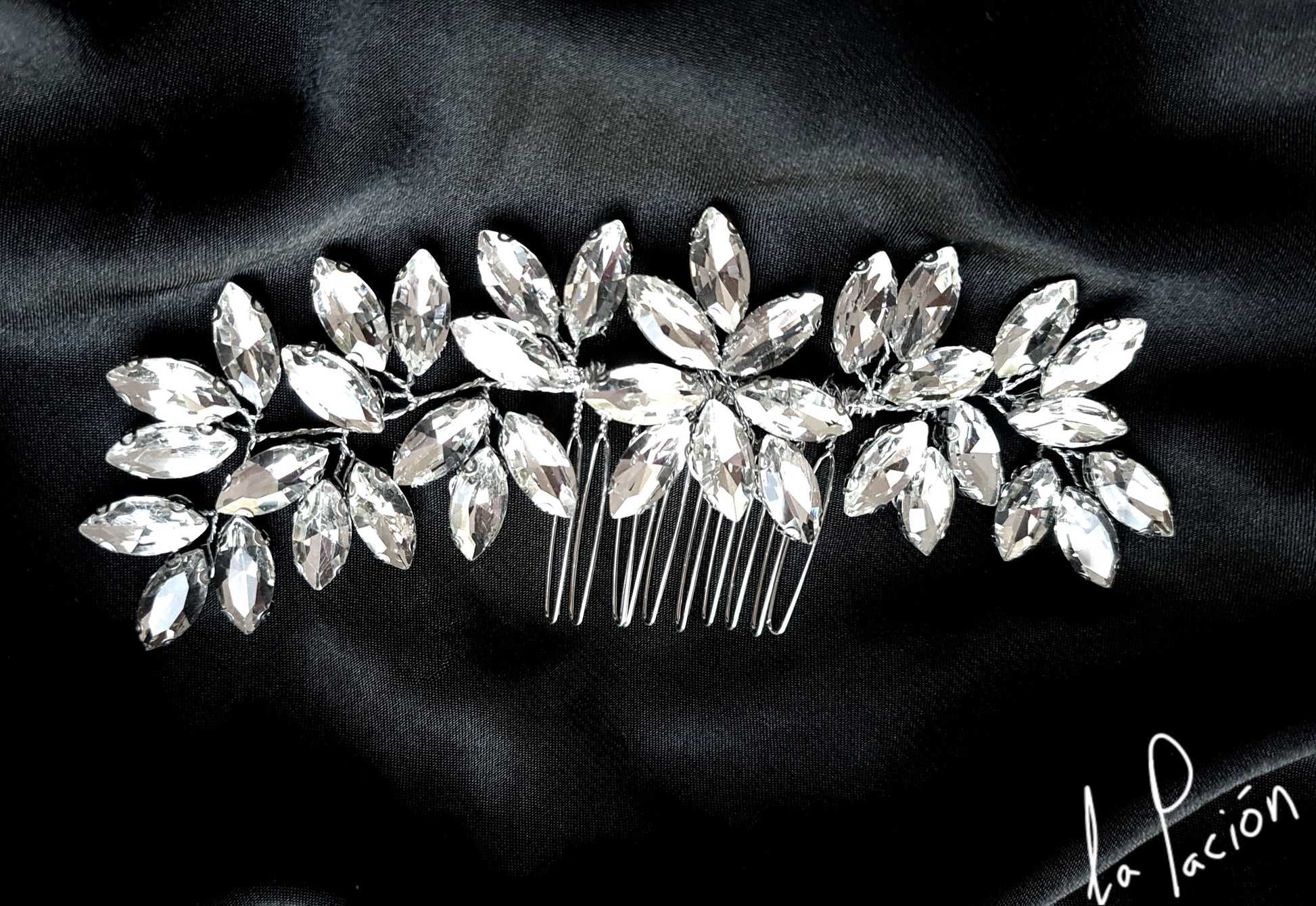 Ella Bridal Hair Comb showcasing its intricate design featuring sparkling cubic zirconia stones set in gleaming silver