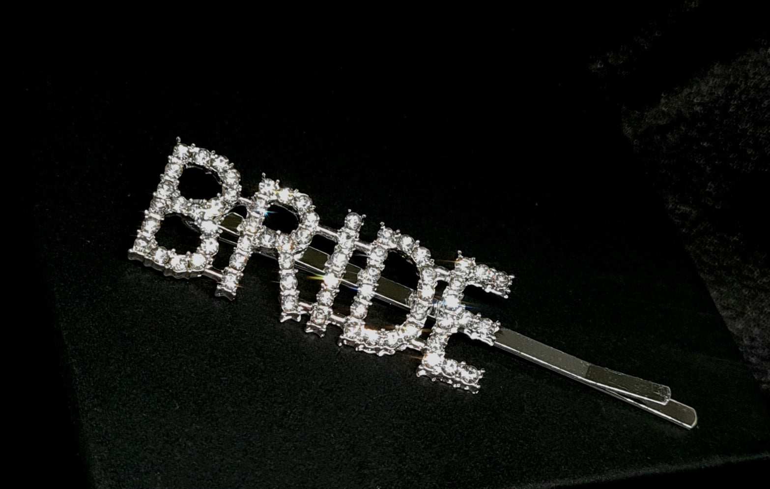 Bride Pin an elegant accessory crafted in silver with radiant crystal accents and cubic zirconia stones.