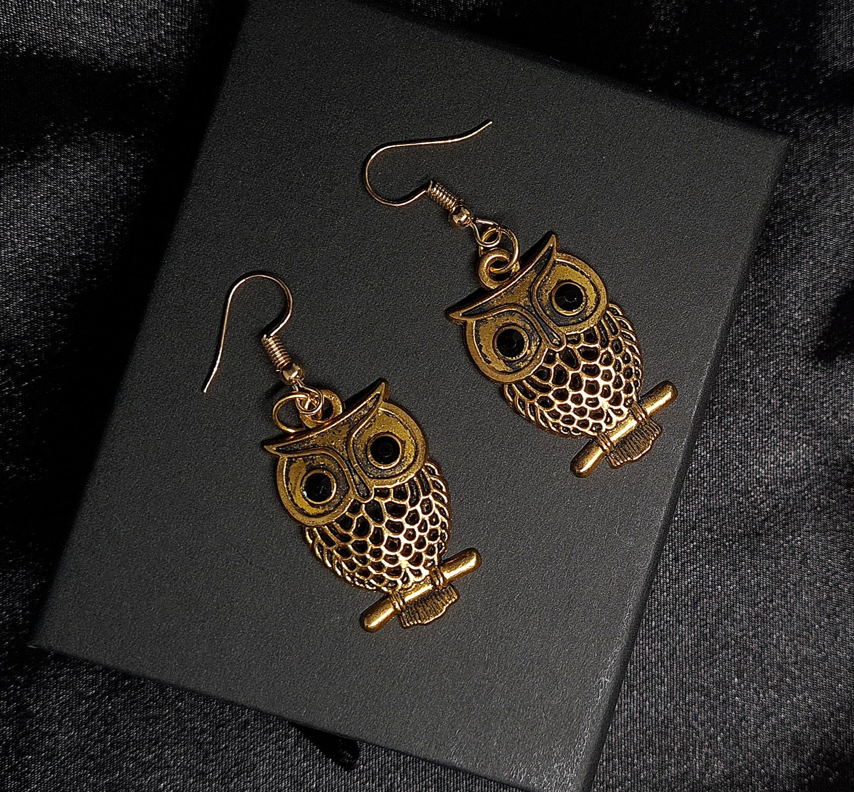 Astrid Earrings sparkling golden metal and adorable owl charm with exquisite details.