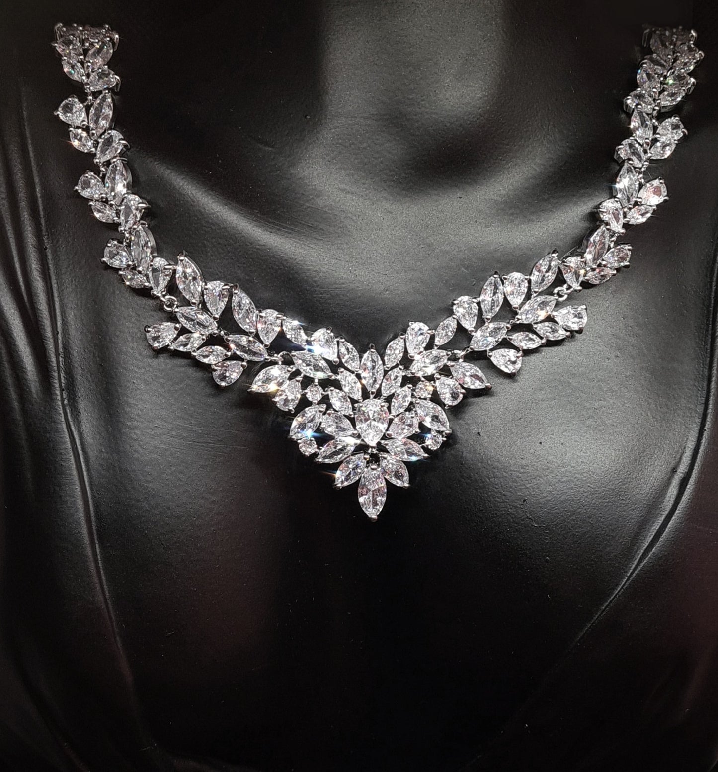 Anne Marie necklace with intricate floral design and sparkling cubic zirconia stones.