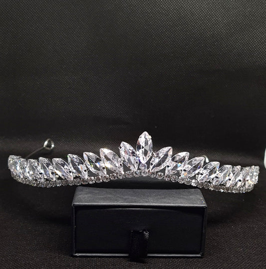 A marquise-cut cubic zirconia tiara set on a black velvet surface. The tiara has a delicate, intricate design and is approximately 16 cm in diameter and 2.5 cm tall.