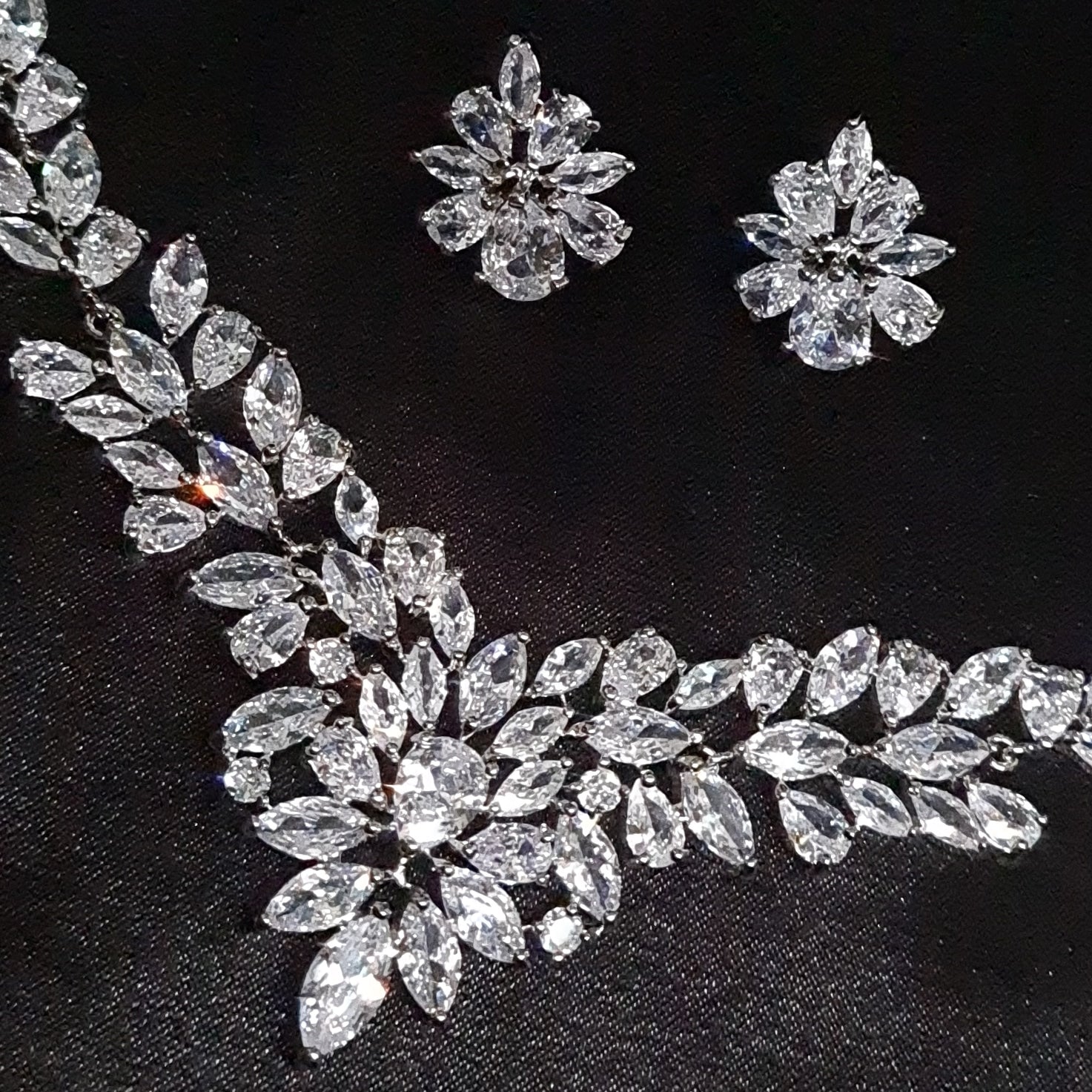 Anne Marie necklace with intricate floral design and sparkling cubic zirconia stones.
